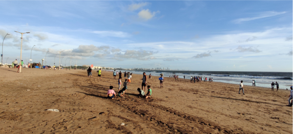 Photo of people on a beach in Mumbai, India